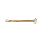Flat lay of the 18K gold woven chain ring demonstrating the innovative flexible loop closure and brilliant bezel-claw set marquise diamond.
